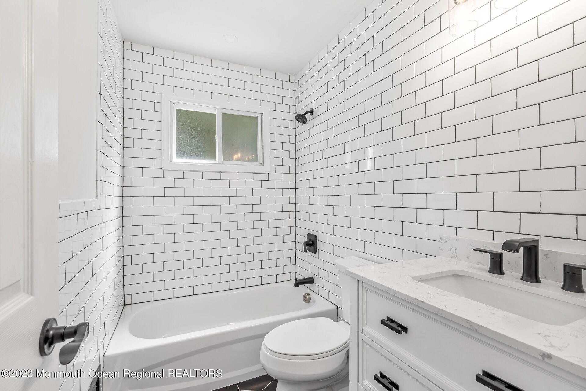 28 Copperfield Drive Hamilton, NJ 08610 - Photo 16 of 26 a bathroom with a sink a toilet and shower