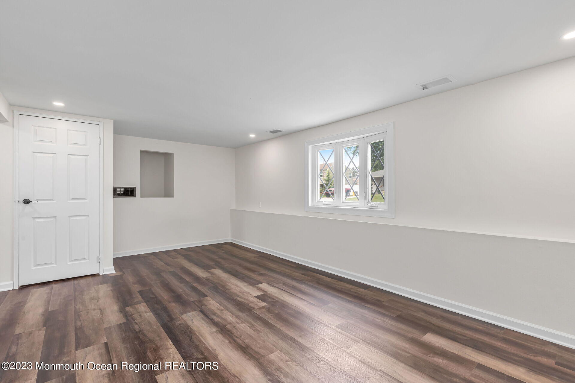 28 Copperfield Drive Hamilton, NJ 08610 - Photo 18 of 26 a view of empty room with wooden floor and fan