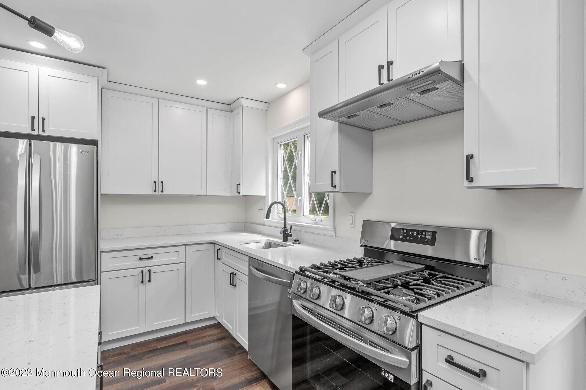 28 Copperfield Drive Hamilton, NJ 08610 - Photo 4 of 26 a kitchen with stainless steel appliances granite countertop a stove and a refrigerator