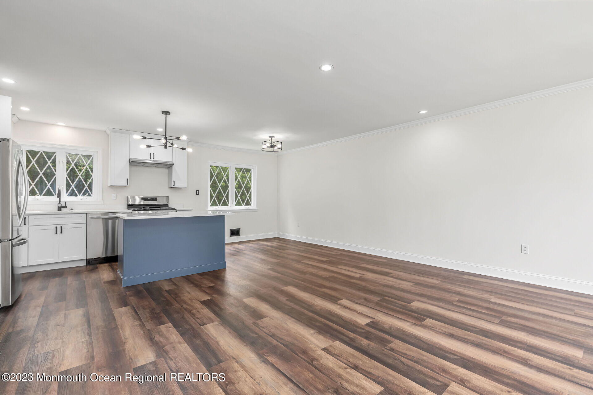 28 Copperfield Drive Hamilton, NJ 08610 - Photo 8 of 26 a large kitchen with kitchen island a sink dishwasher a stove and a refrigerator with wooden floor
