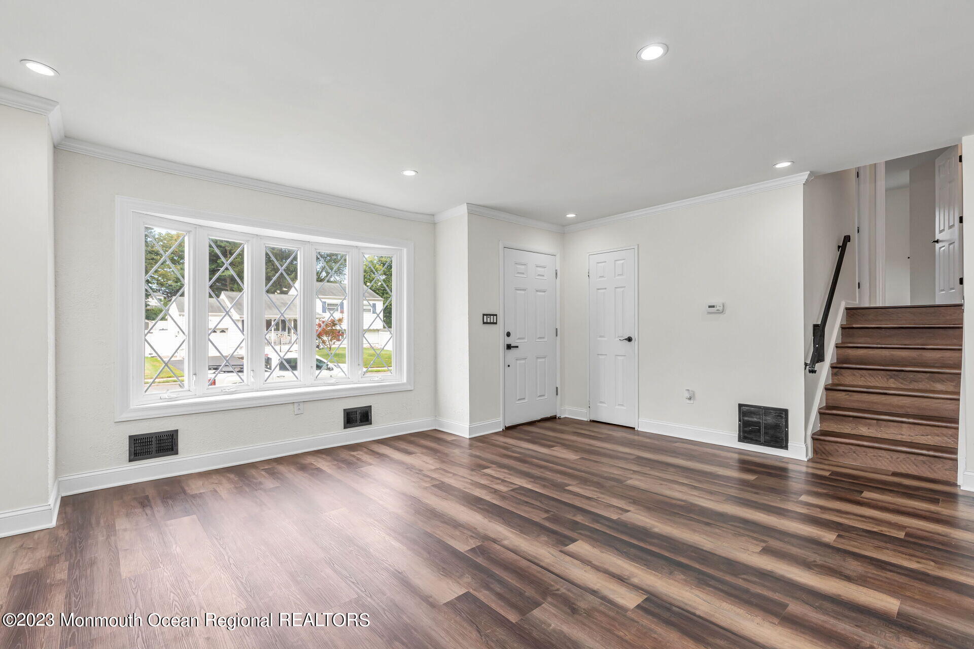 28 Copperfield Drive Hamilton, NJ 08610 - Photo 9 of 26 a view of an empty room with wooden floor and a window