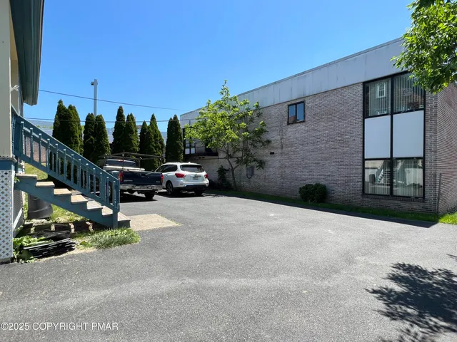 a view of street with parked cars