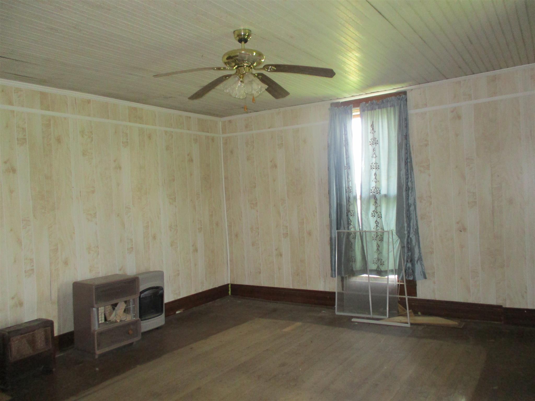 846 Edwards Road Lebanon, TN 37090 - Photo 14 of 30 a view of a livingroom with hardwood floor and a ceiling fan