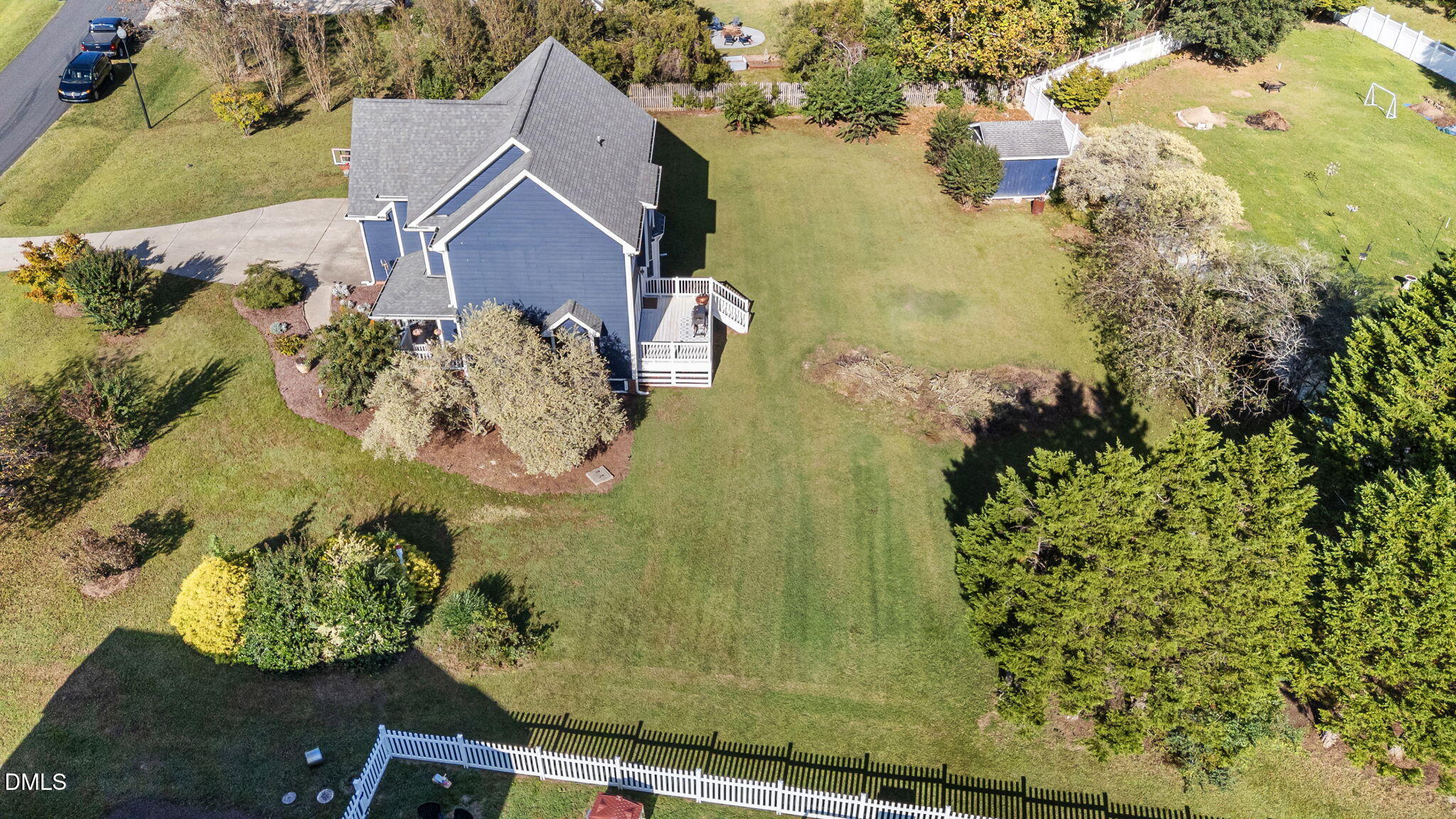 1617 Kendall Hill Road Willow Spring, NC 27592 - Photo 16 of 58 an aerial view of a house with a yard and lake view