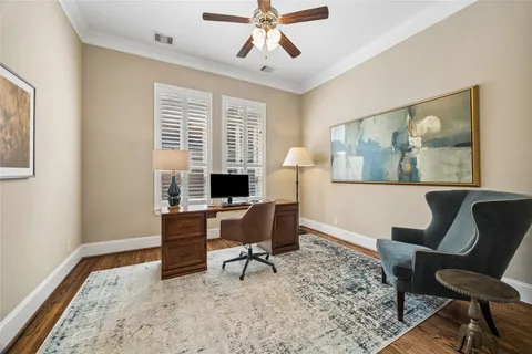 a view of a hallway with wooden floor and closet