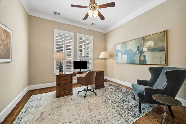 a view of a hallway with wooden floor and closet