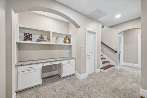 a bathroom with a sink mirror and toilet