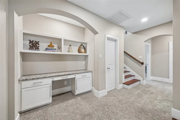 a bathroom with a sink mirror and toilet