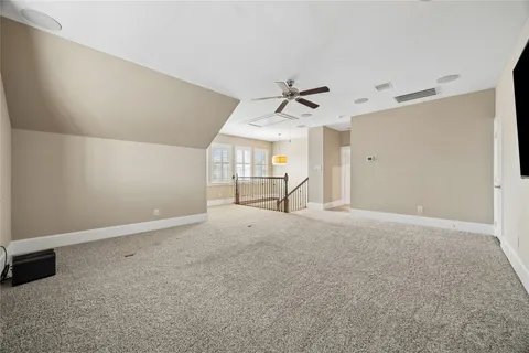 a bathroom with a granite countertop sink a toilet a mirror and bathtub