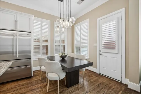 a kitchen with stainless steel appliances granite countertop a stove and cabinets
