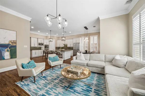 a living room with fireplace furniture and a flat screen tv
