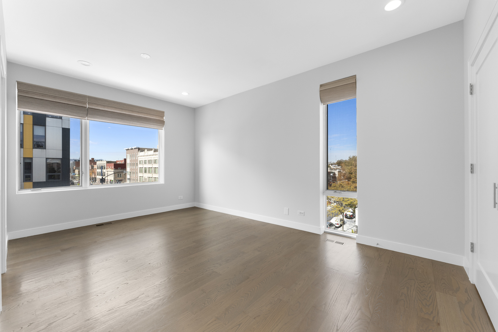 1555 North Talman Avenue, Unit 3F Chicago, IL 60622 - Photo 19 of 37 a view of a livingroom with wooden floor and a kitchen