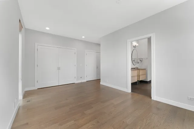 a view of an empty room with a closet