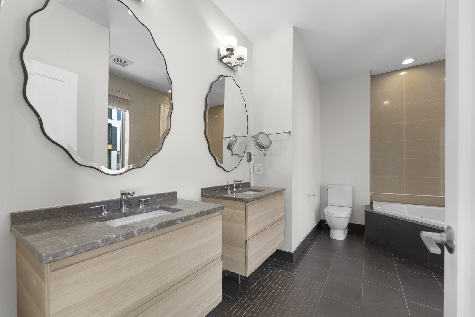 1555 North Talman Avenue, Unit 3F Chicago, IL 60622 - Photo 23 of 37 a bathroom with a granite countertop sink a toilet and a mirror