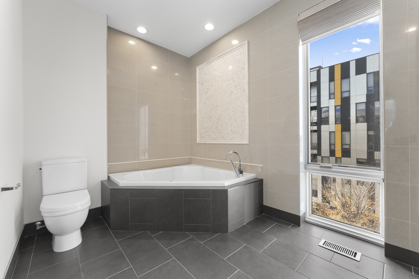 1555 North Talman Avenue, Unit 3F Chicago, IL 60622 - Photo 24 of 37 a spacious bathroom with a bathtub shower sink mirror and toilet