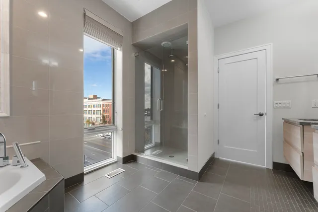 a view of a hallway with a bathroom