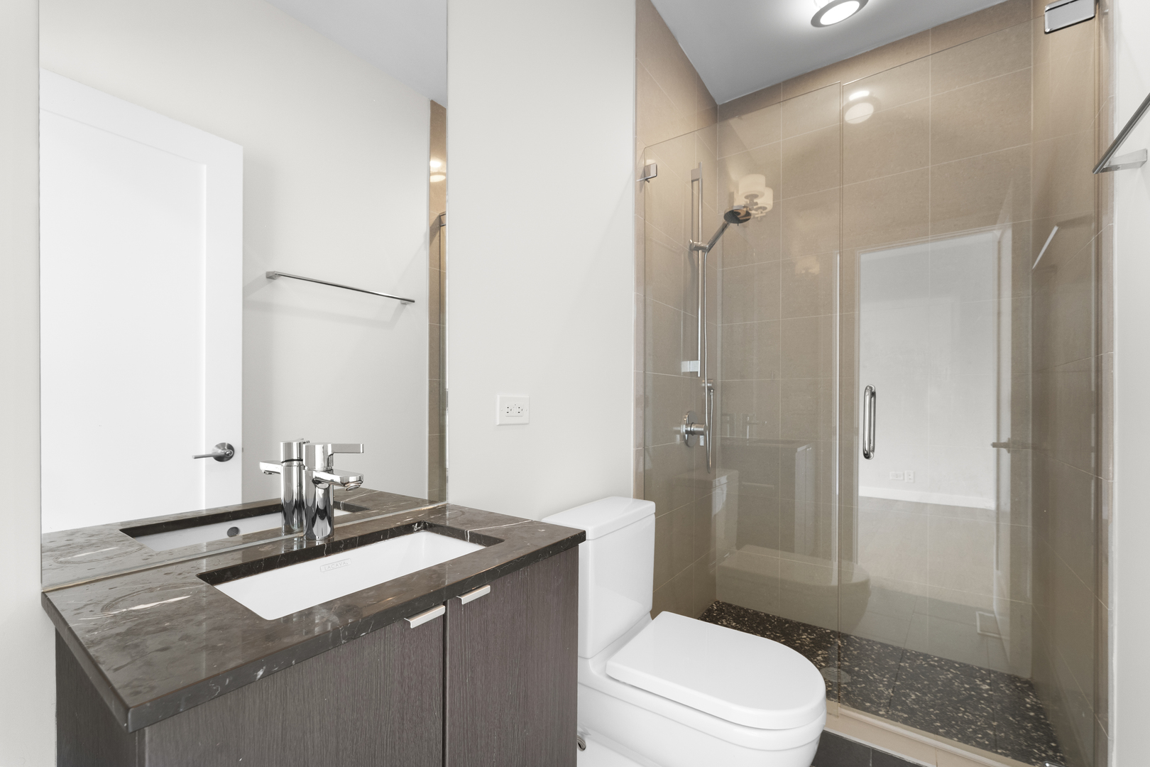 1555 North Talman Avenue, Unit 3F Chicago, IL 60622 - Photo 30 of 37 a bathroom with a sink toilet vanity and shower