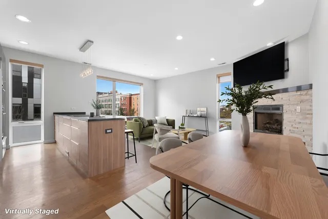 a living room with fireplace furniture and a flat screen tv