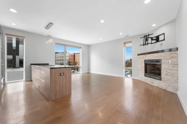 a view of kitchen with cabinets and wooden floor