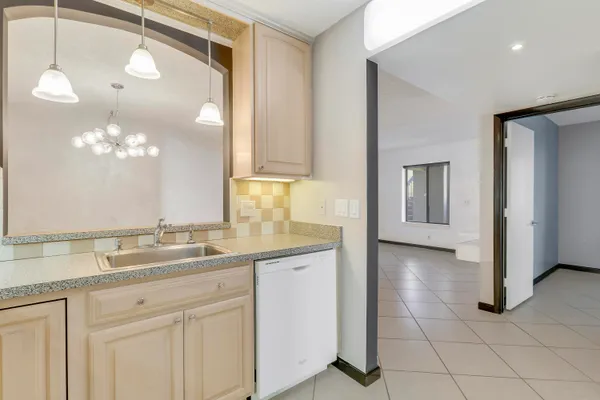 a bathroom with a sink a vanity and a mirror