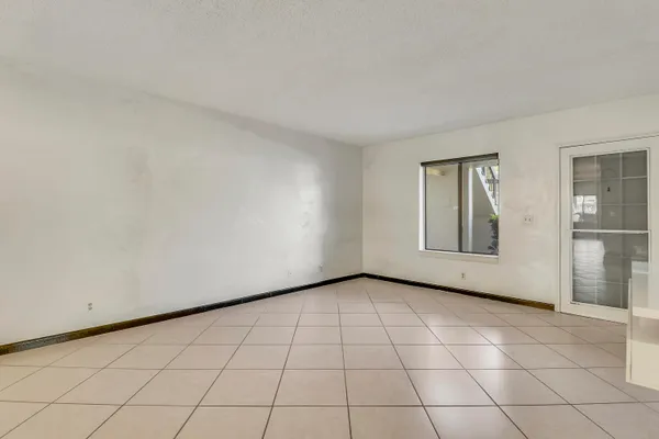 a view of an empty room and window