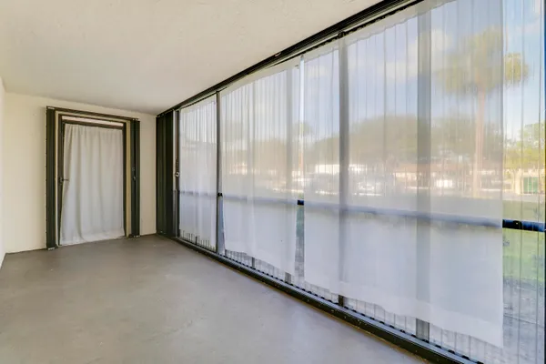 a view of an empty room and window