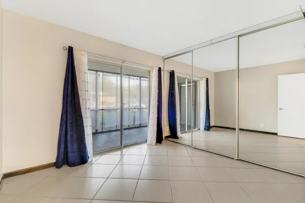 a view of a utility room with sliding door