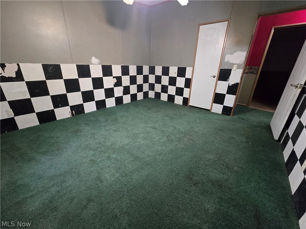 1389 Old Kyle Road Dorset, OH 44032 - Photo 13 of 14 View of carpeted spare room