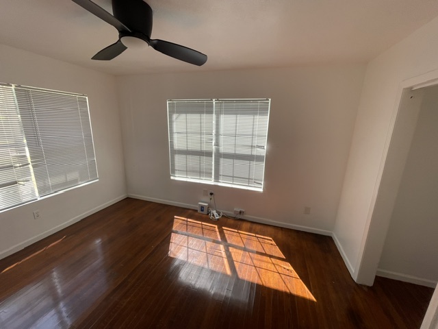 4611 Glissman Road Austin, TX 78702 - Photo 10 of 11 Hardwood floors and generous window light create an inviting atmosphere.