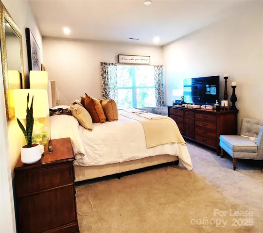 a bedroom with a bed and dresser