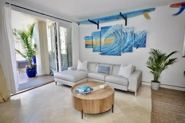 a living room with furniture and a large window