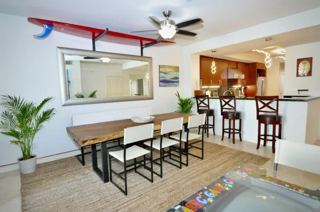 a view of a dining room with furniture and wooden floor