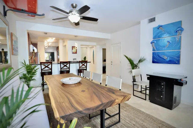 a dining room with furniture and window
