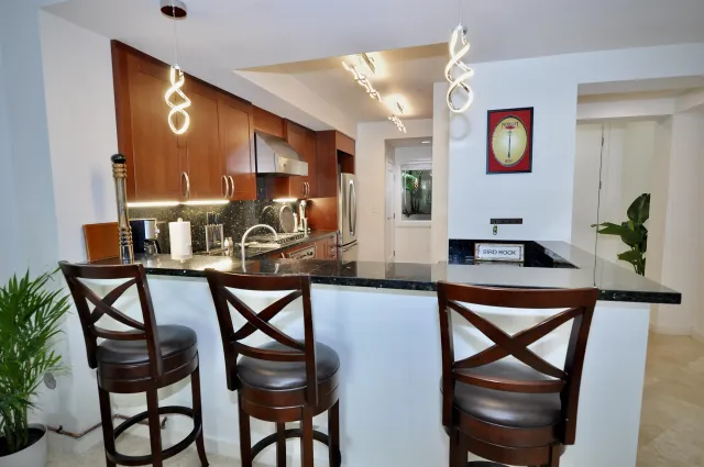 a view of a dining room with furniture and window
