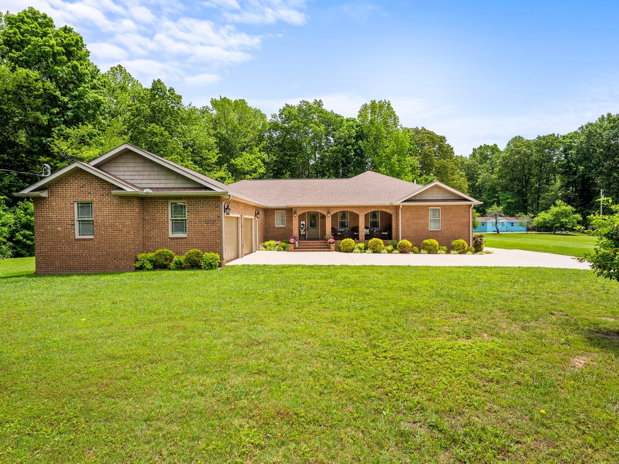 a front view of a house with garden