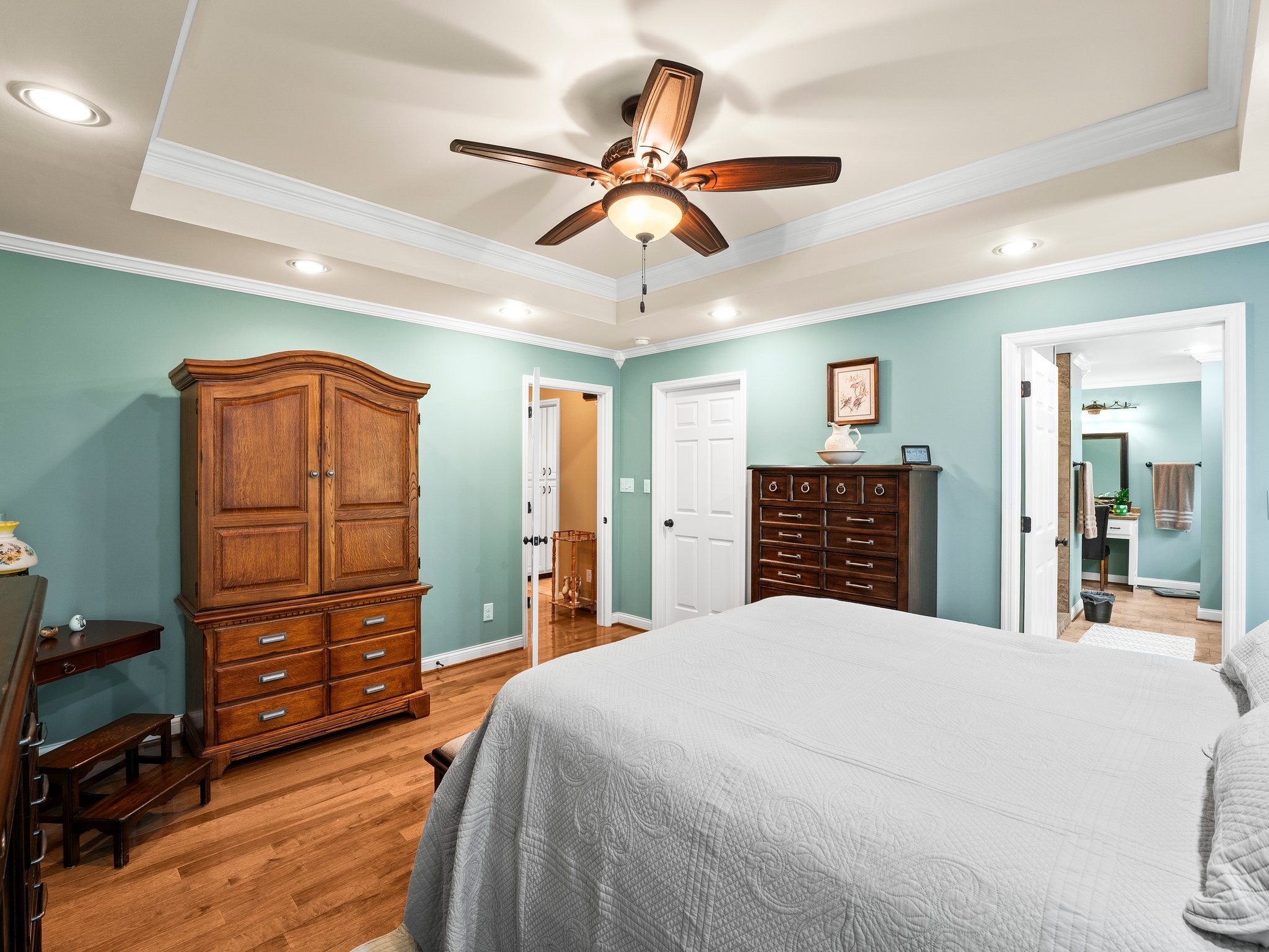 1574 Midway Road Sewanee, TN 37375 - Photo 17 of 45 a bedroom with a bed and a chandelier