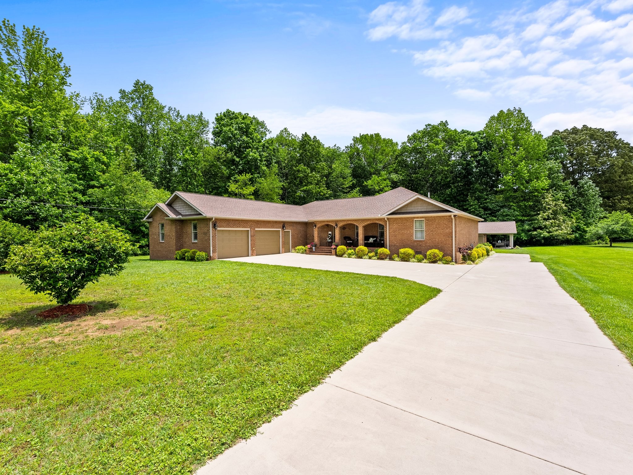 1574 Midway Road Sewanee, TN 37375 - Photo 2 of 45 a front view of a house with garden