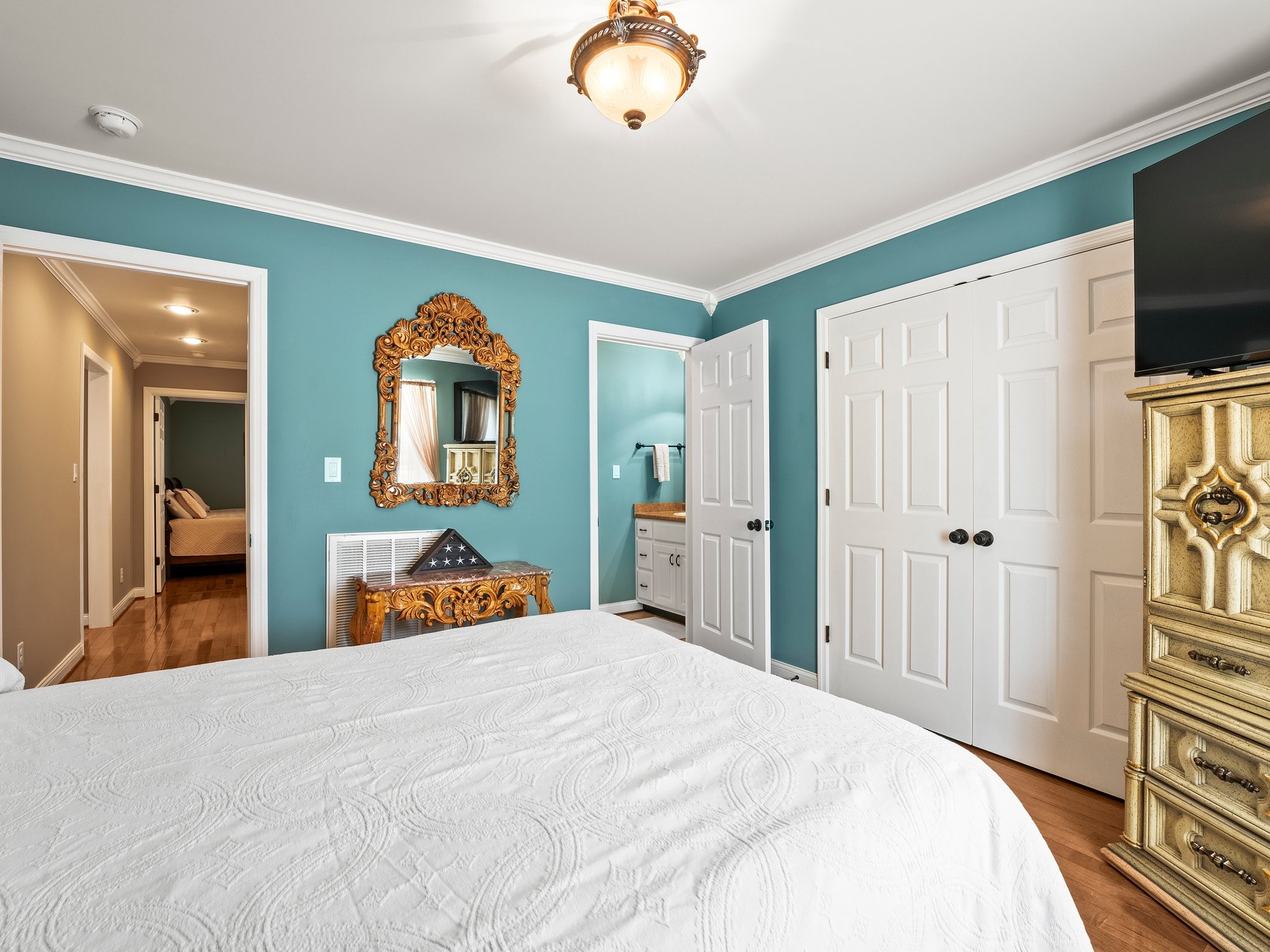 1574 Midway Road Sewanee, TN 37375 - Photo 28 of 45 a bedroom with bed and a flat tv screen on dresser