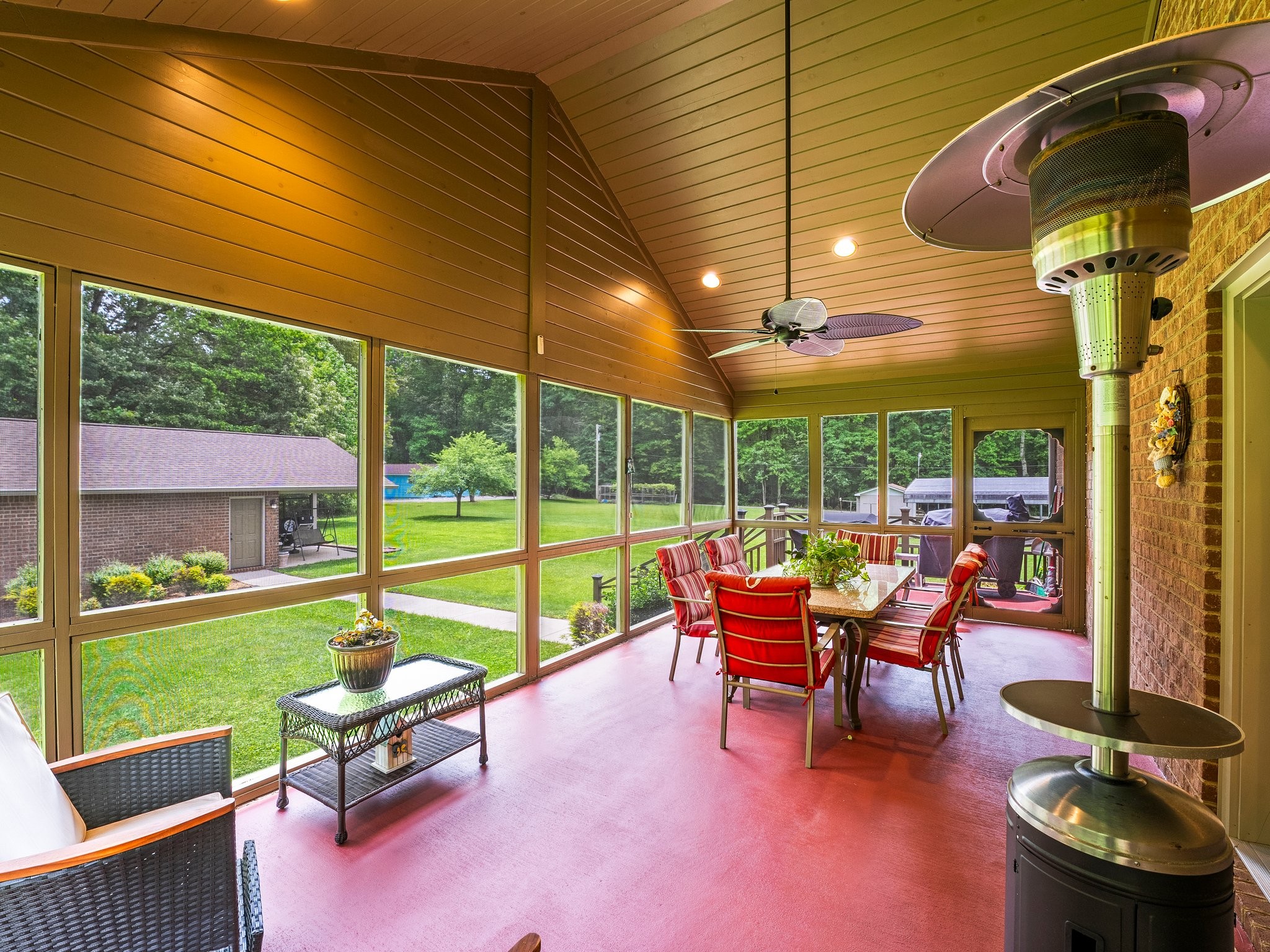 1574 Midway Road Sewanee, TN 37375 - Photo 34 of 45 a view of a patio with a table chairs and a backyard