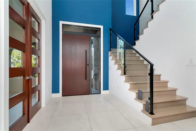 a kitchen with stainless steel appliances a stove a sink and a refrigerator