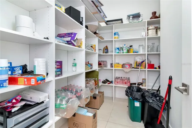 a spacious bathroom with a tub sink mirror and toilet