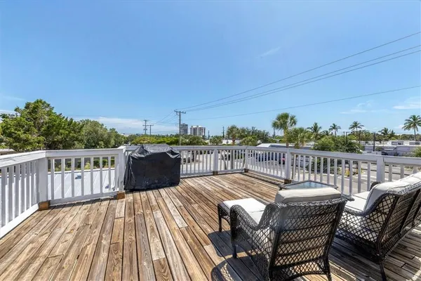 a view of a chairs on roof deck