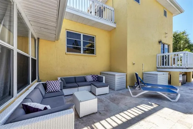 a view of a patio with swimming pool table and chairs