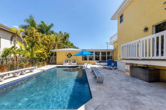 a view of a chairs and table in the patio