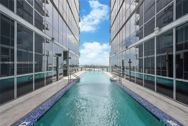 a view of balcony with yard