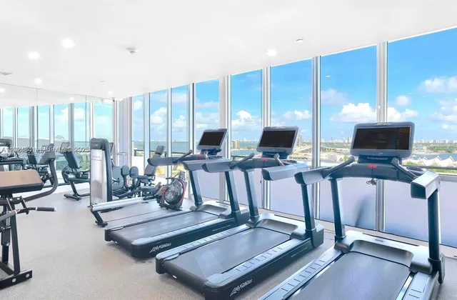 a view of a living room with gym equipment