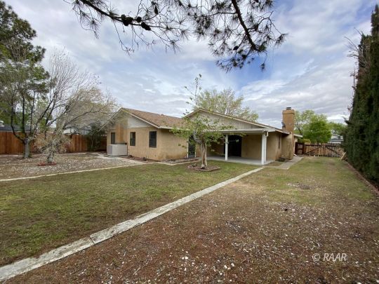717 North Inyo Street Ridgecrest, CA 93555 - Photo 7 of 26 a front view of a house with garden
