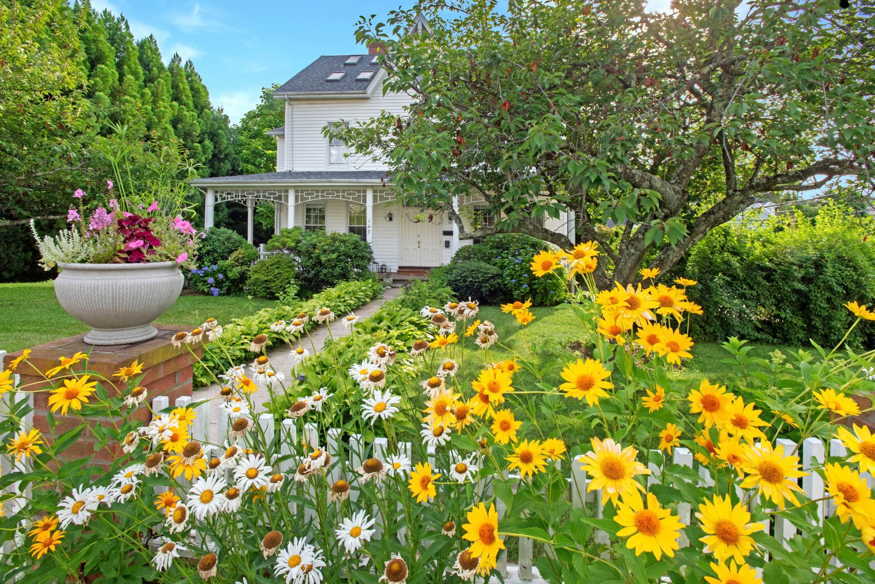 167 Park Street, Unit 1 New Canaan, CT 06840 - Photo 11 of 11 a view of a house with a yard and garden