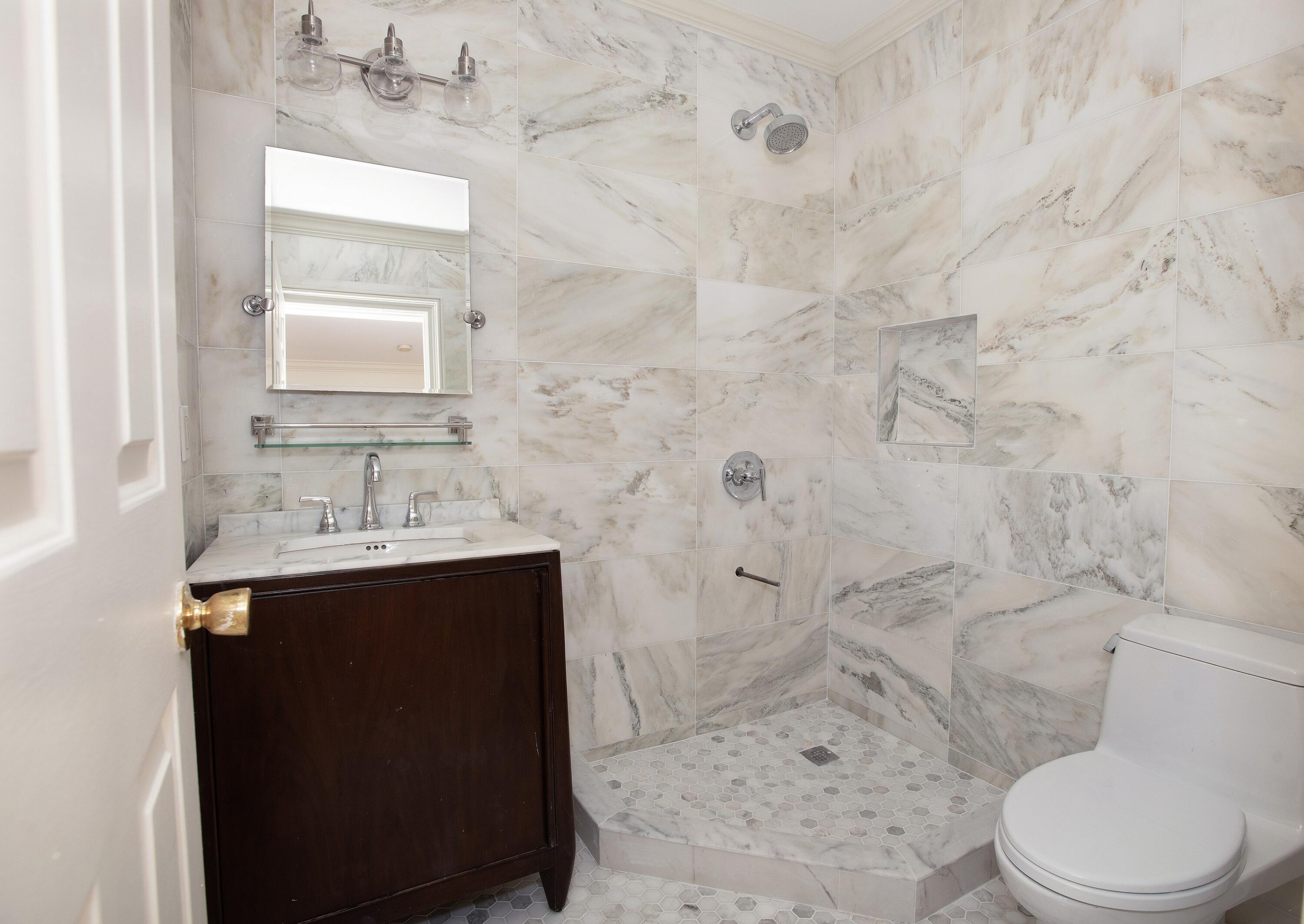 167 Park Street, Unit 1 New Canaan, CT 06840 - Photo 9 of 11 a bathroom with a sink toilet and shower