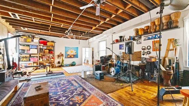a view of a dining room with furniture and a chandelier
